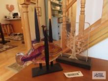 Sea glass sculpture and tree with birds silhouette