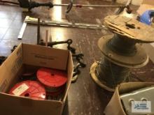(4) PARTIAL SPOOLS OF CABLE WIRE, VARIOUS SIZES