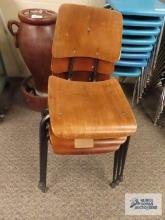 Three wooden and metal school chairs