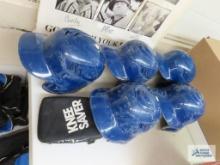 Five baseball helmets and one knee saver
