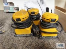 Three drywall palm sanders
