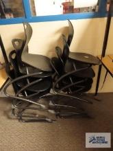 Eight school chairs