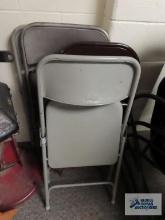 Four metal folding chairs
