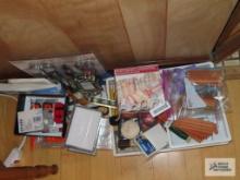 Scissors, coin wrappers, pencil sharpeners, pencils, stapler, envelopes, etc.