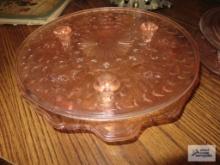 Two pink depression glass cake plates