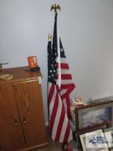 Two American flags on poles