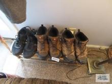 Merrell work boots, size 11 and Under Armor tennis shoes on shoestand