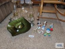 Clown figurines, Princess House serving pieces, oil lamps, glasscovered candy dish, and pewter