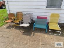 Variety of outdoor chairs, including children's two seat benches