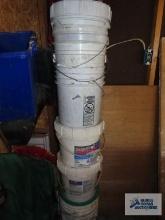 Variety of empty buckets.