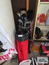 Golf clubs and two golf club bags