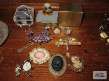 Variety of costume jewelry rings, brooches, etc