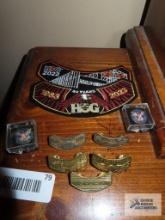 Harley Davidson hog patches, the president's call to service award pins, and Harley Davidson hog