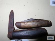 Two assorted pocket knives. Both are rusty.