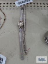 Victoria Rhein watch with silver colored band, missing glass on face and extra band
