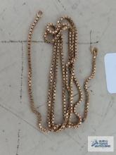 Gold colored necklace, no clasp, marked 750.