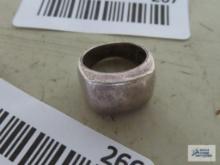 Silver colored solid band ring, marked 925.