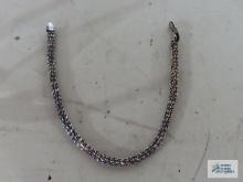 Silver colored bracelet, marked 925 Italy. Clasp needs repaired.