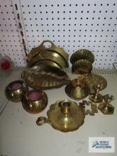 Various brass pieces including candlesticks, candy dish, napkin holder, candle holders
