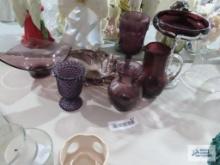 Purple glassware including candy dishes, candle holder, vase