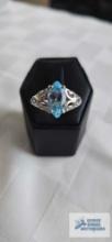 Silver colored ring with blue topaz stone, marked 925, approximately 4.2 G, size 10