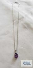 Silver colored pendant with purple stone, marked 925 on the silver colored chain, marked 925, 2.9 G.