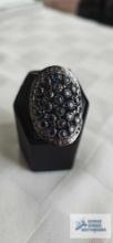Silver colored ring with blue stones, marked 925 (marcasite), approximately 9.5 G, size 7
