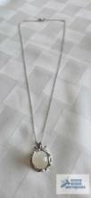 Silver colored pendant with cloudy stone (moon stone) on silver colored chain, both marked 925, 8.5