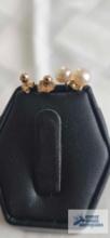 Gold colored pearl and ball earrings. Both marked 14K.