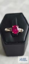 Two tone ring with red stone and diamond, marked 10K, 2.34 G, size 7
