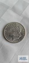 1883 Morgan one dollar coin, marked O