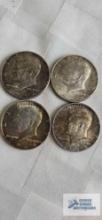 (4) 1964 Kennedy half dollar coins.