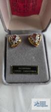 Gold colored earrings with pinkish stone and clear surrounding stones, marked 925