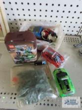 Assorted Legos and toy cars and plastic army men
