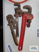Ridgid 10" pipe wrench, 8" antique wrench, and wooden handled antique pipe wrench