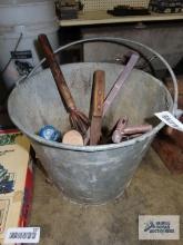 Metal bucket with assorted tools