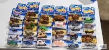32 of the 2000 Virtual Collection series Hot Wheels cars, new in packages.