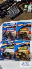 Four Hot Wheels Monster Jam monster trucks new in packages including He-man Masters of the Universe,