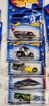 One 2000 CD Customs series Hot Wheels car, two 2000 Secret Code series Hot Wheel cars and Two 2000