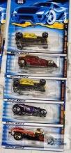 2000 Hot Rod Magazine series and two 2001 Skull and Crossbones series Hot Wheels cars, new in
