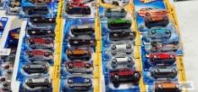 New Hot Wheels cars in packages, including 2007 and 2010