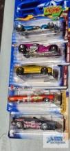 Three of the 2002 Spectra Flame Hot Wheels cars and two of the 2004 Cereal Crunchers Hot Wheels