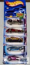 Three 2002 Trump Cars series and two Spectraflame 2 Hot Wheels cars, new in packages