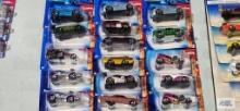 Sixteen 2004 First Editions Tooned Hot Wheels cars, new in packages