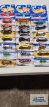 Twenty-one 1998 First Editions Hot Wheels cars, new in packages