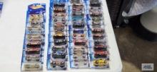 Eight 2003 Hot Wheels cars new in packages and Thirty-five 2003 First Editions Hot Wheels cars, new