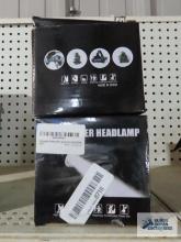 Pair of power headlamps in boxes
