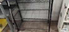 Black metal adjustable shelving unit