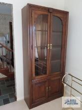 Fruitwood china cabinet with bottom storage. On first floor.