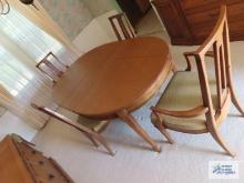Drexel fruitwood table with six chairs, table protectors, two extra leaves, buffet, and breakfront.
